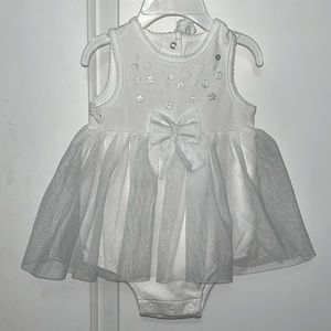 2 girls dress that are both white and silver